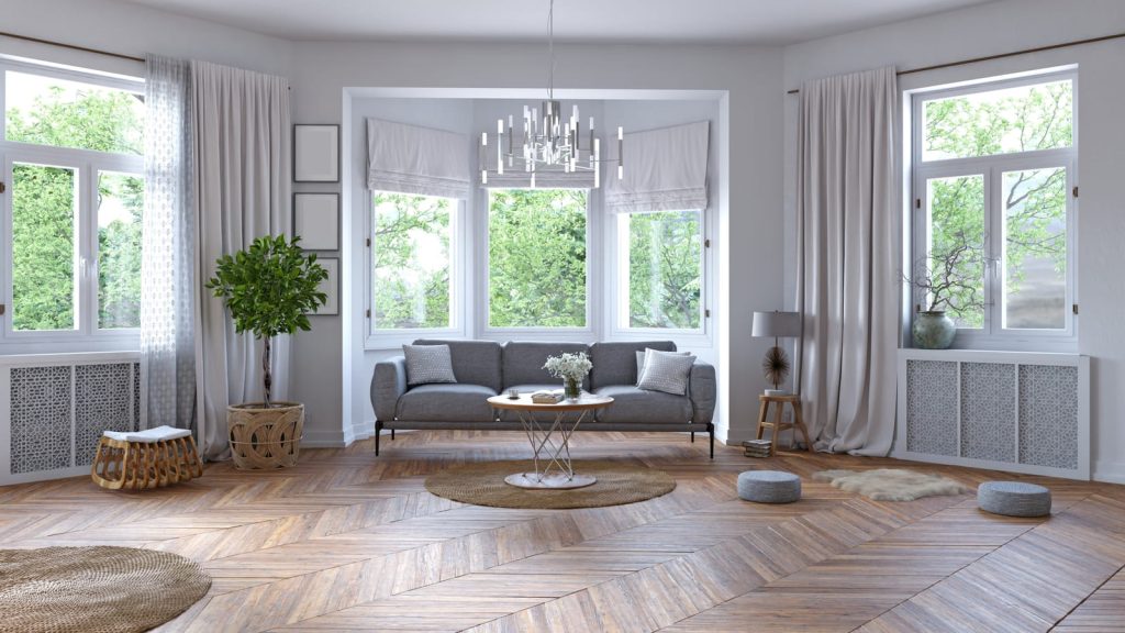 Soggiorno arredato in stile moderno con colori chiari per divani e pareti